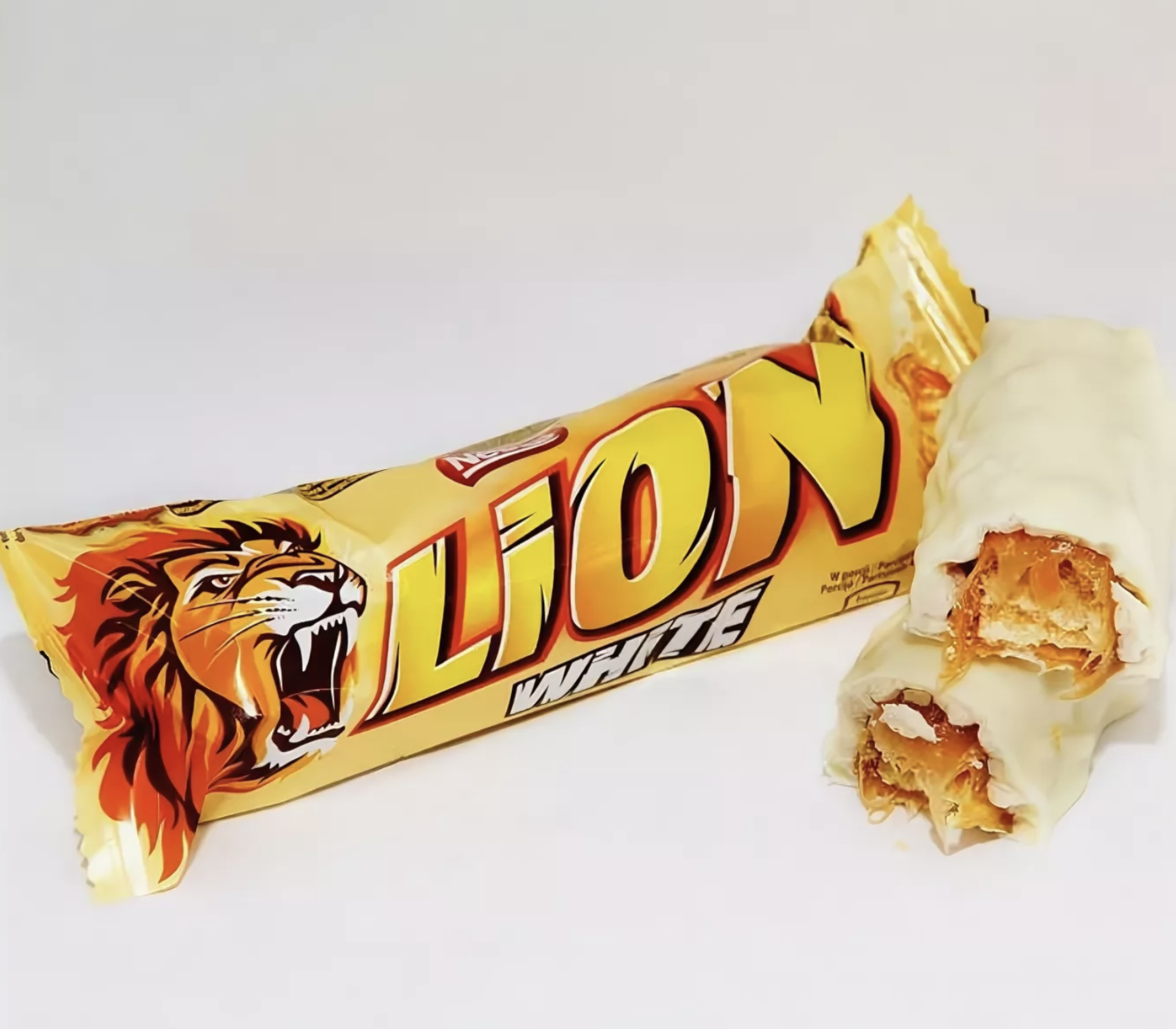 Lion White батончик 42гр. Шоколадный батончик Lion Standart Caramel 42г. Lion (Nestle) White ШОК. Батончик 42г 40шт. Лайон / Lion шоколадный батончик.